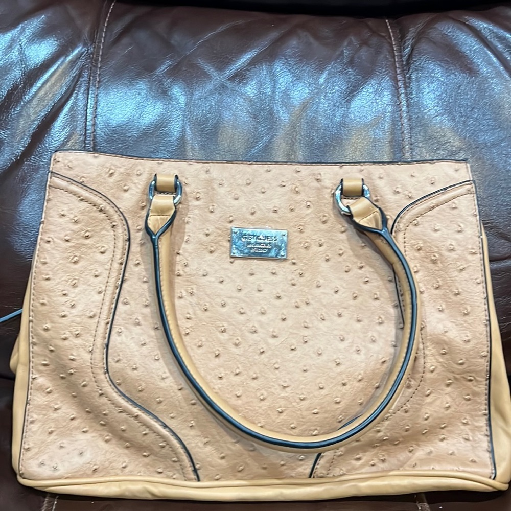 It’s a beige handbag never used it has no tags on it
